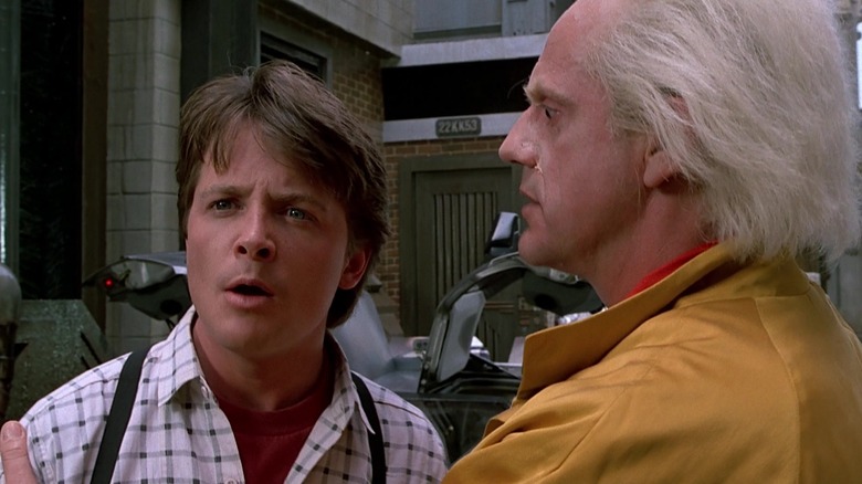 Marty looks amazed as Doc takes him by the shoulders in Back to the Future Part II