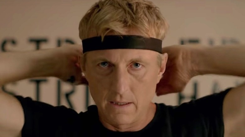 William Zabka's Johnny Lawrence tying a headband on Cobra Kai