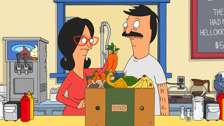 Linda (John Roberts) and Bob Belcher (H. Jon Benjamin) examine a box of produce in Bob's Burgers