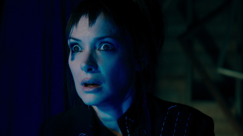 Winona Ryder as Lydia Deetz looking in shock in the attic in Beetlejuice Beetlejuice