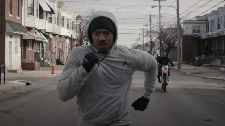 Creed 2015 Adonis running in the street