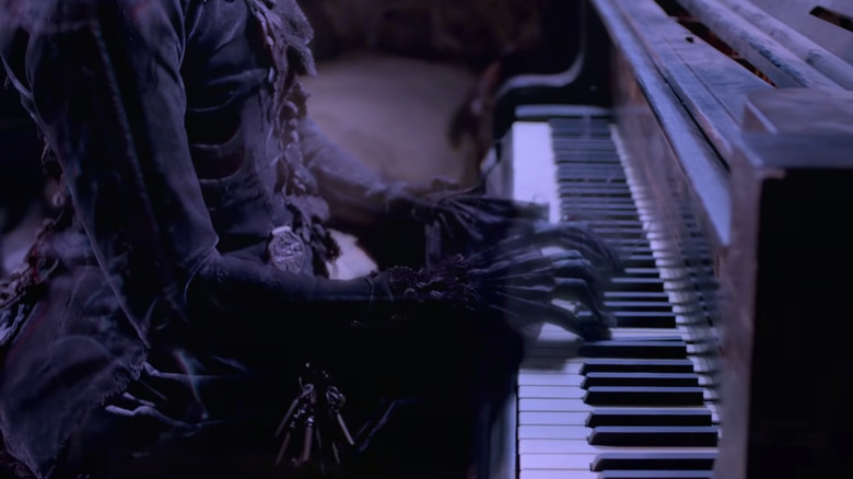 A ghost plays the piano in Crimson Peak