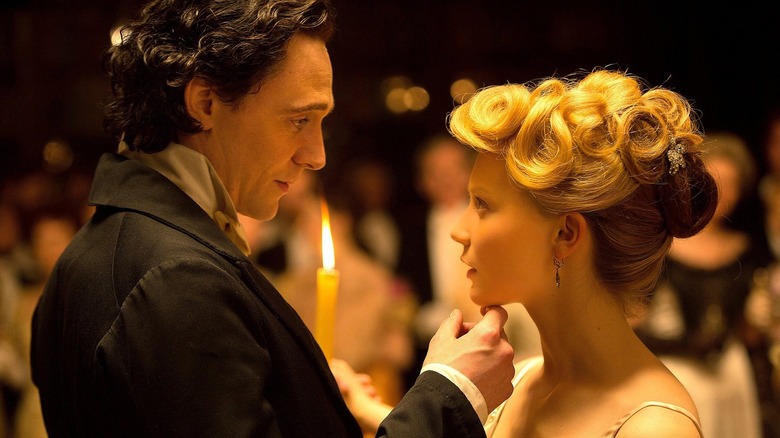 Tom Hiddleston and Mia Wasikowska in front of a candle in Crimson Peak