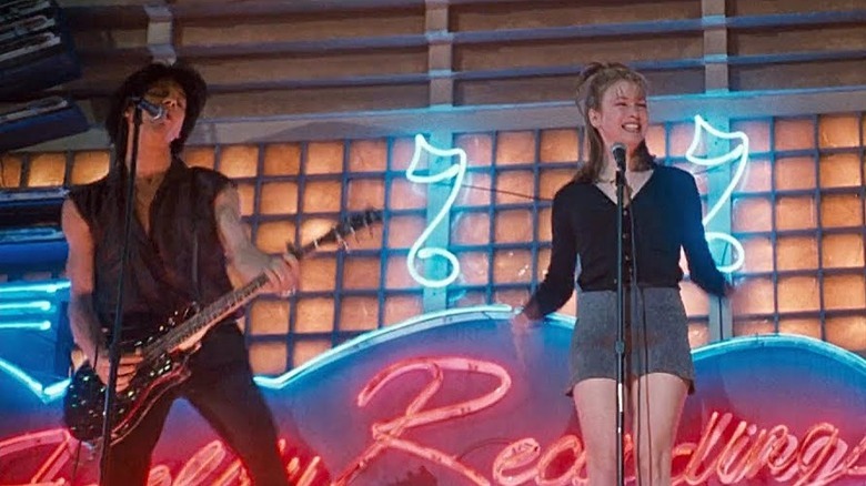 Gina and Berko perform "Sugar High" on the Empire Records marquee
