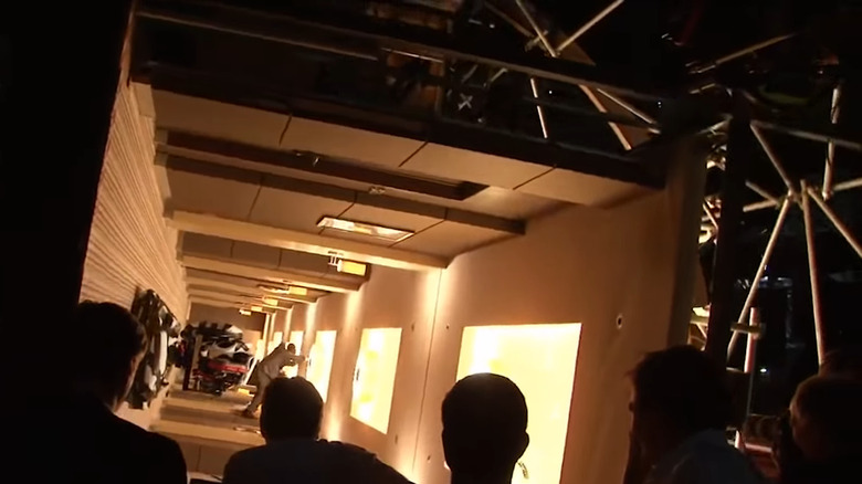 Joseph Gordon-Levitt performing stunt choreography in a rotating hallway set