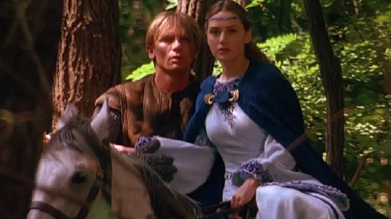 Master Kane and Princess Sarah on a horse in the woods in A Kid in King Arthur's Court