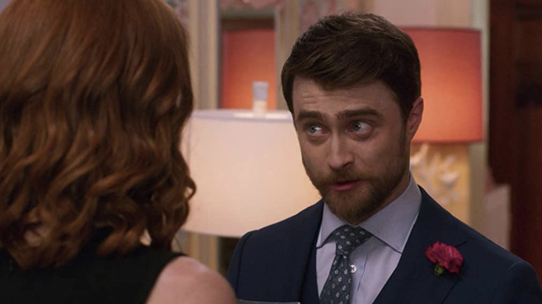 Daniel Radcliffe wearing a jacket and tie