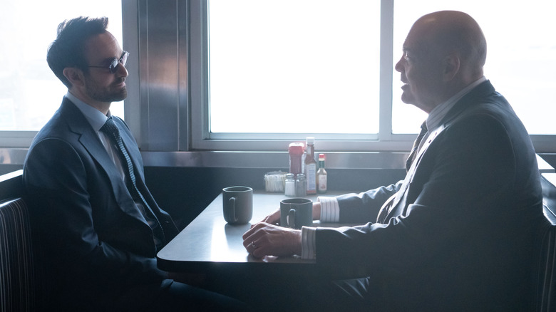 Matt and Wilson sit across from each other at a diner in Daredevil: Born Again