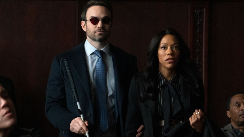 Charlie Cox as Matt Murdock and Nikki M. James as Kirsten McDuffie standing at court in Daredevil: Born Again