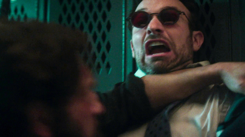 Charlie Cox's Matt Murdock pinned up against a locker by the Punisher (Jon Bernthal) in Daredevil: Born Again