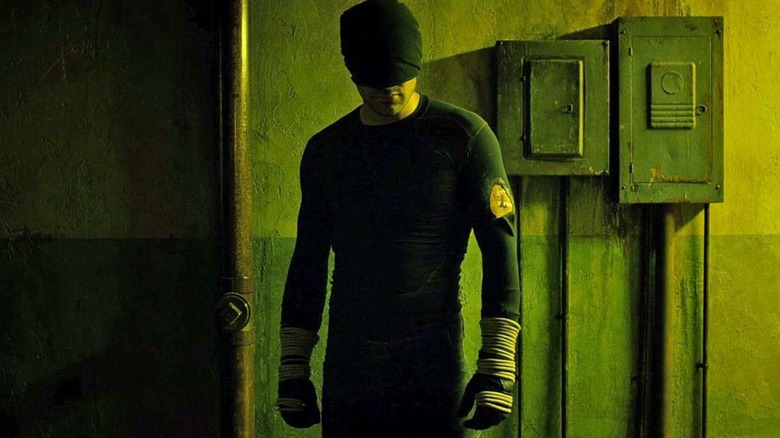 Daredevil standing in hallway, about to fight, at end of episode 