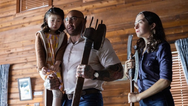 Kristen Cui, Dave Bautista, and Abby Quinn in Knock at the Cabin