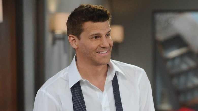 Seeley Booth smiling with his tie untied on Bones