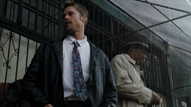 Brad Pitt as David Mills and Morgan Freeman as William Somerset standing in the rain in Se7en