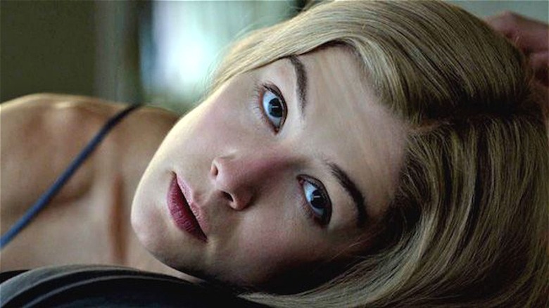 Amy Dunne stares across the bed