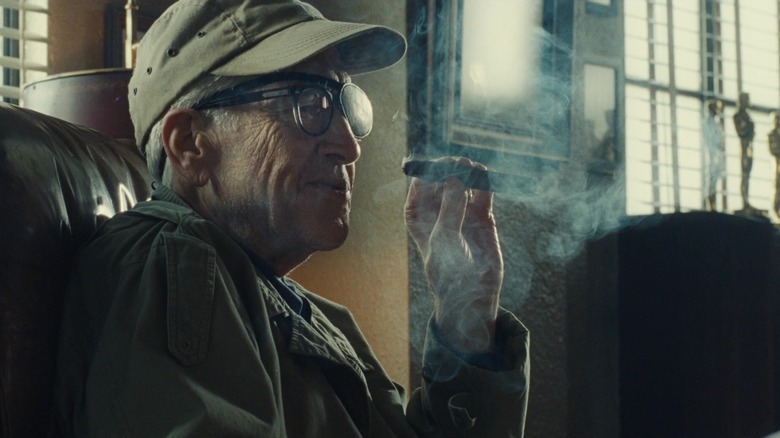 John Ford lights a cigar in The Fabelmans