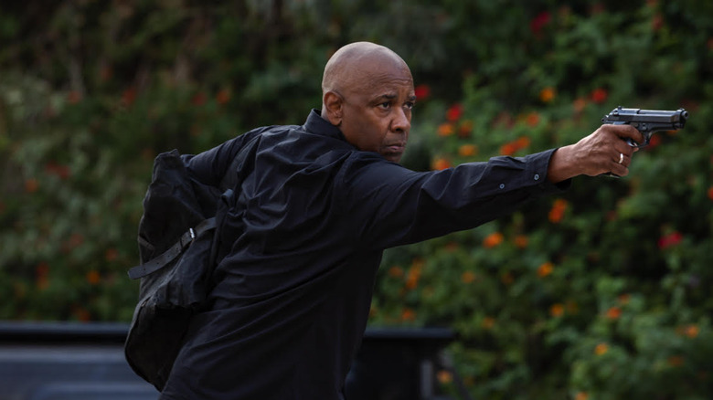 Denzel Washington as Robert McCall with his gun out in The Equalizer 3