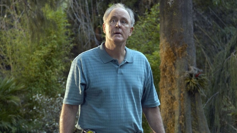 John Lithgow as Arthur Mitchell (The Trinity Killer) looking lost in the forest on Dexter