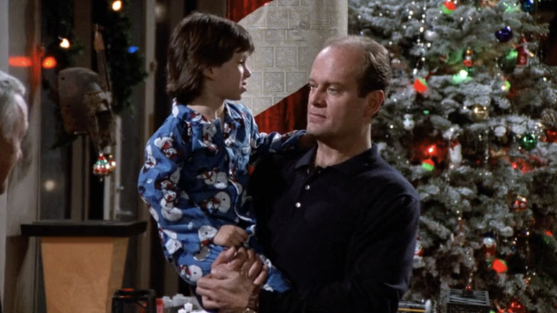 Kelsey Grammer's Frasier Crane holds Luke Tarsitano's Frederick Crane in Frasier