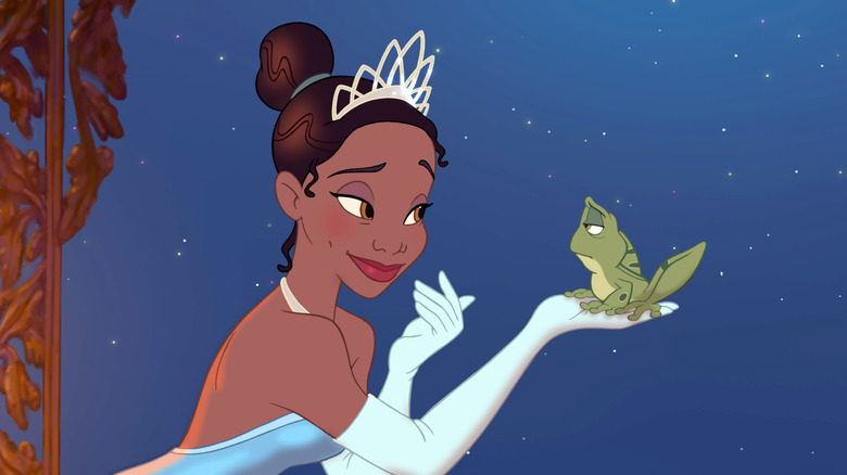 Tiana talking to a frog on a balcony in The Princess and the Frog