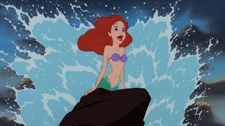 Ariel singing on rock