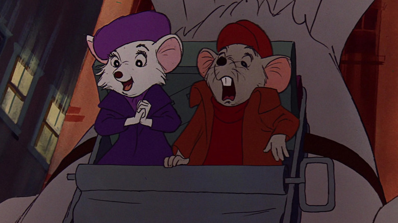 Bianca is delighted to be on the back of a diving bird, while Bernard is terrified. A scene from The Rescuers.