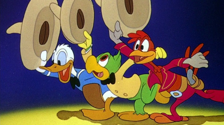 Donald, Jose, and Panchito waving their sombreros in The Three Caballeros