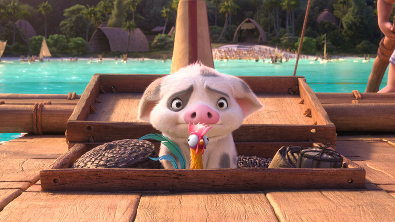 Pua and Heihei from "Moana 2," peeking up from a ship's storage room