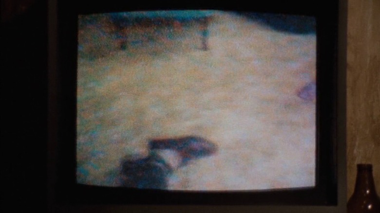 TV screen displaying footage of a foot