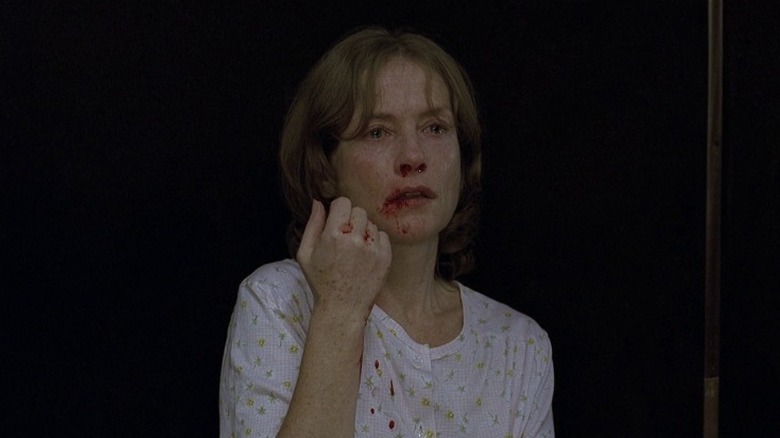 Erika Kohut with a bloodied face and teary eyes