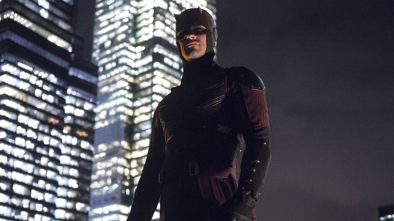 Charlie Cox's Matt Murdock in his full costume looking out over the city in Daredevil