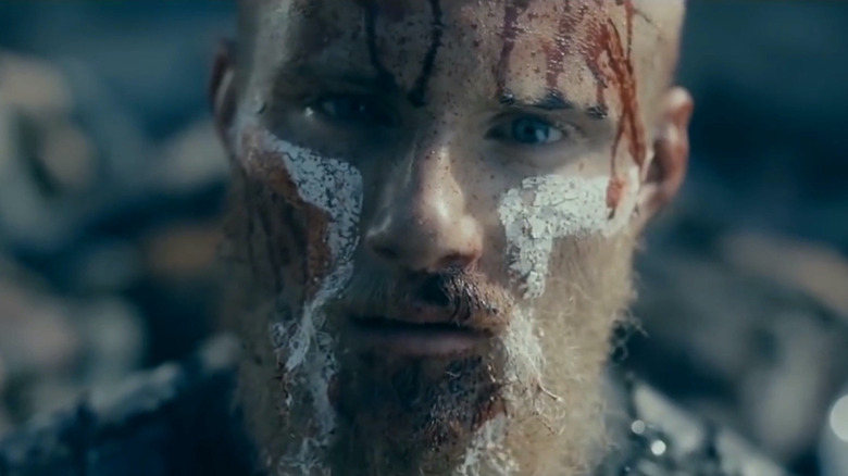 Bjorn Ironside staring intensely with blood on his face in Vikings