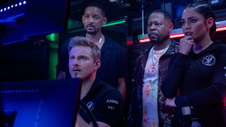 Dorn, Mike, Marcus, and Kelly staring at a monitor in concern in Bad Boys: Ride or Die