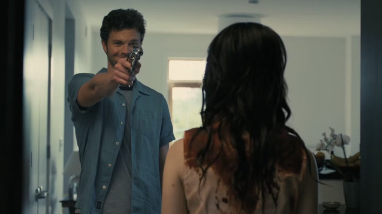 Josh points a gun at Iris in Companion