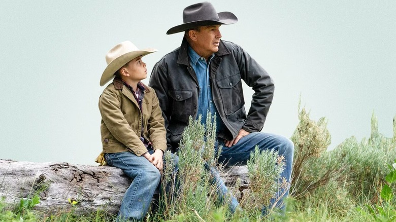 Tate Dutton sitting next to John Dutton in Yellowstone