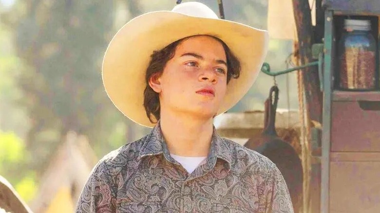 Grown-up Tate Dutton wearing a cowboy hat in Yellowstone