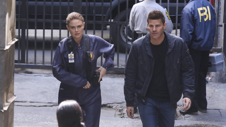 Bones and Booth in police gear Bones