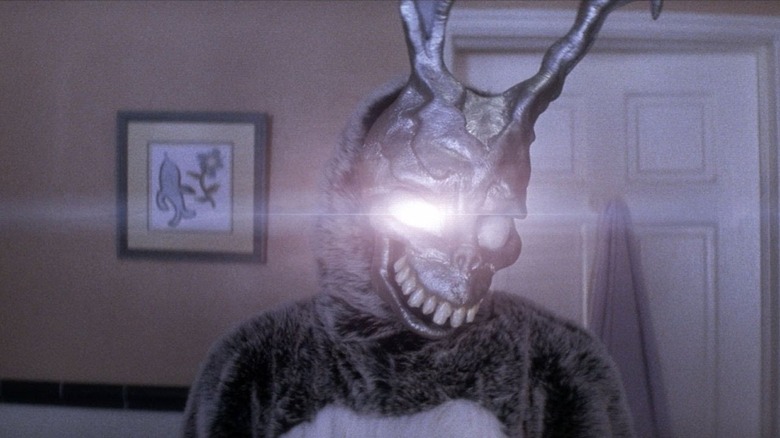 Frank the Rabbit in Donnie's bathroom with a glowing eye, looking in the mirror