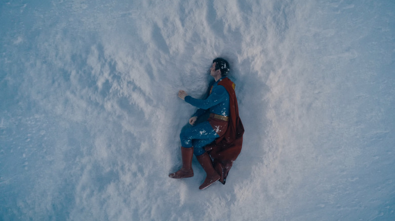 Superman lying defeated in a snow ditch in Superman (2025)