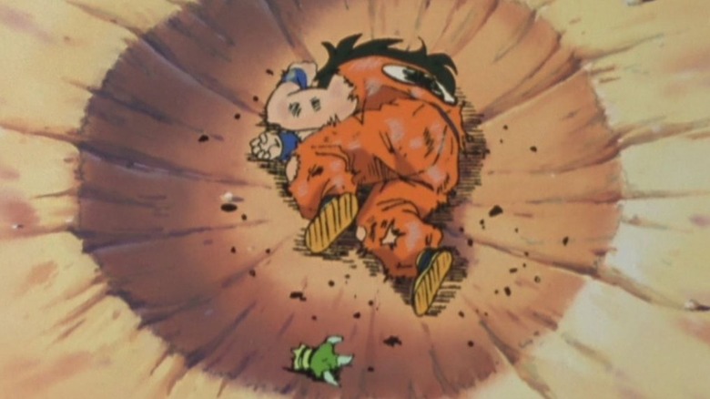 Yamcha lying defeated in a crater in Dragon Ball Z