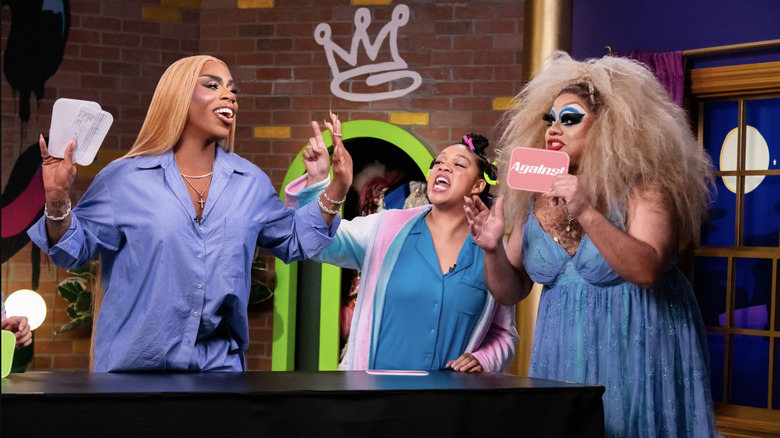 The cast of Monet's Slumber Party playing a party game