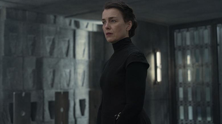 Olivia Williams as Tula Harkonnen clad in black and looking at someone offscreen in Dune: Prophecy