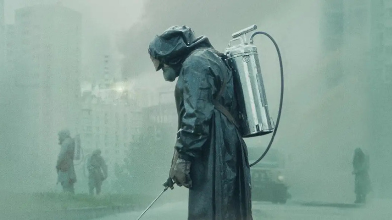 Men in biohazard suits in a poster to "Chernobyl"