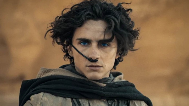 Paul Atreides wearing a breathing apparatus in Dune: Part Two