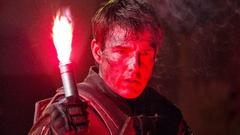 Tom Cruise holding a flare