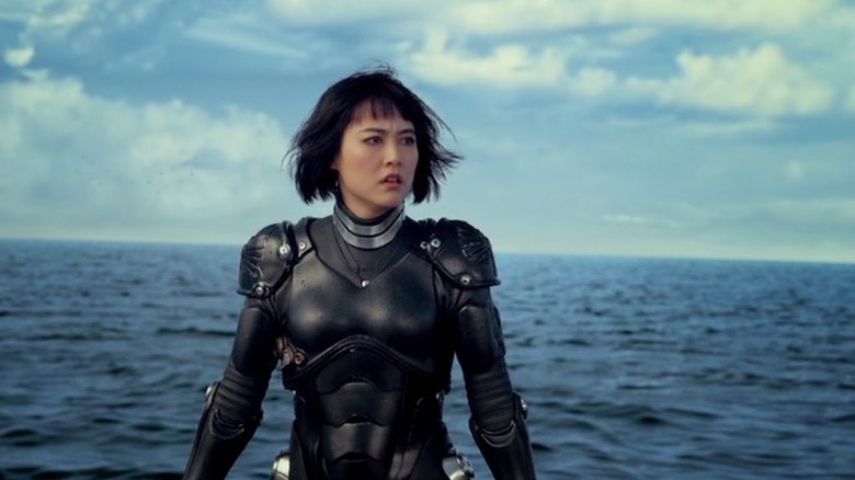 Mako Mori, in her monster-fighting suit, outdoors in the sea.