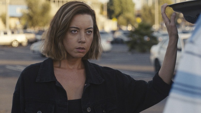 Emily the Criminal Aubrey Plaza at a trunk