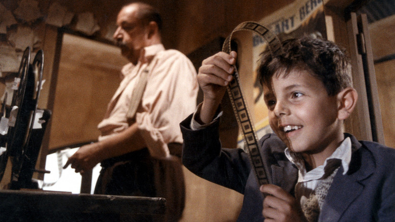 Philippe Noiret and Salvatore Cascio in Cinema Paradiso