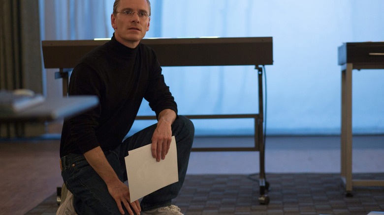 Michael Fassbender holding papers Steve Jobs