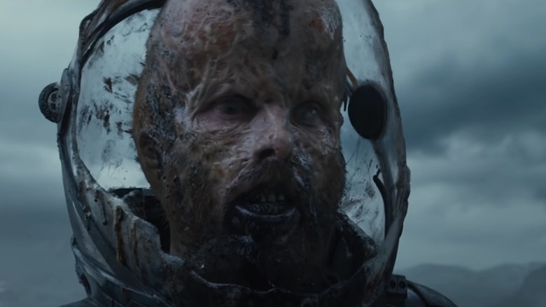 Prometheus' Fifield with deformed face in broken helmet